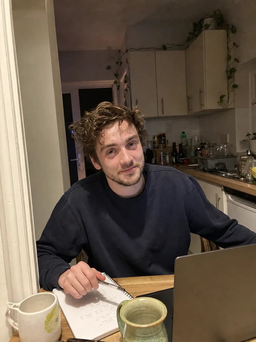 Illustrative learner reviewing theory-test mistakes at a kitchen table