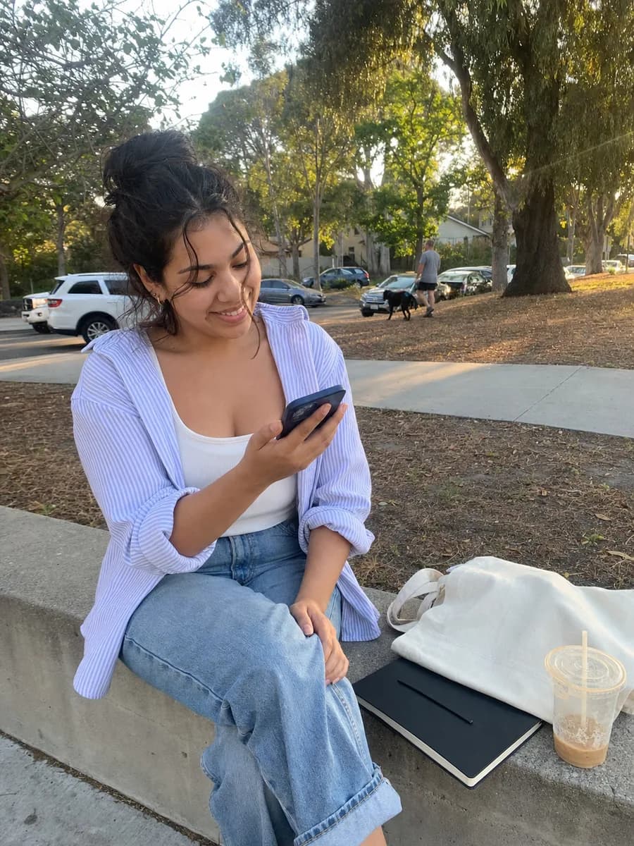 Illustrative learner taking a study break in a San Diego park